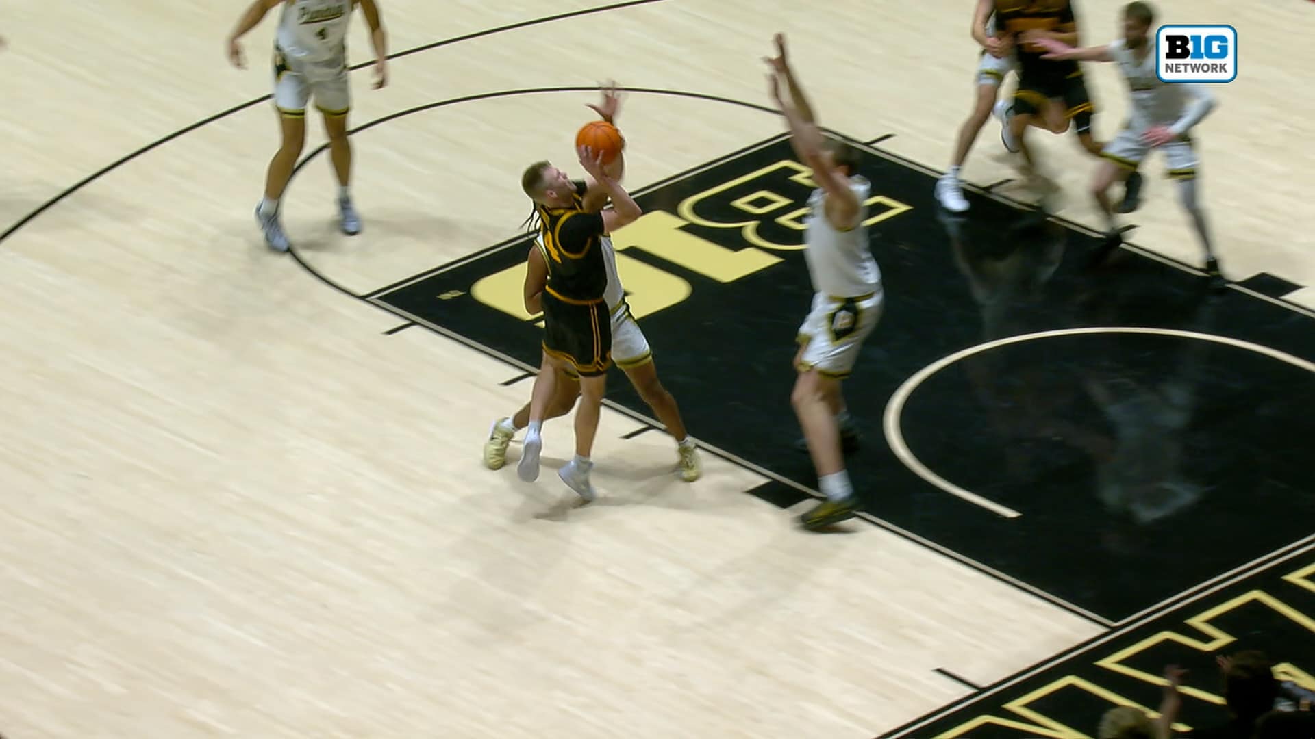 Iowas’ Bennett Stirtz Drives Past His Defender for an And-One Layup vs Purdue